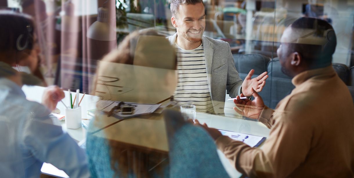 An SEO Consultant coaching his clients in a conference room