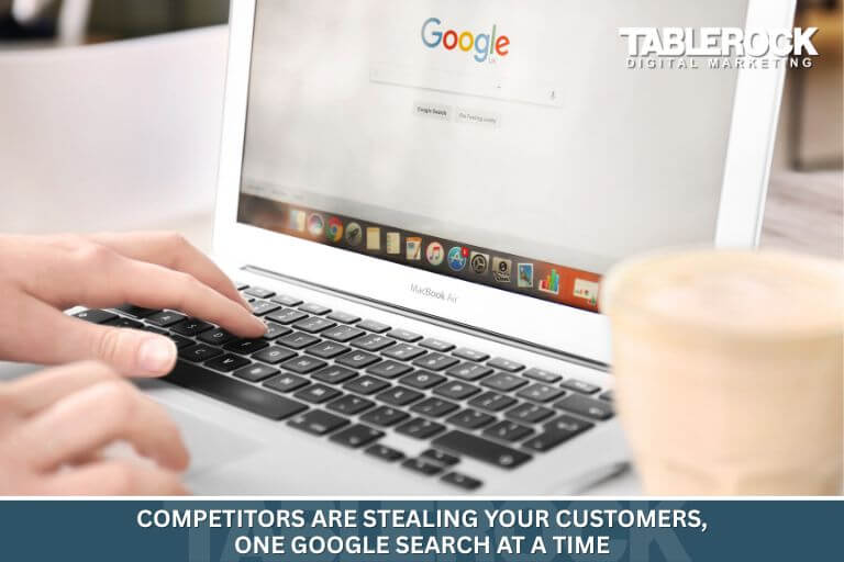 Person on laptop competitors are stealing your customers